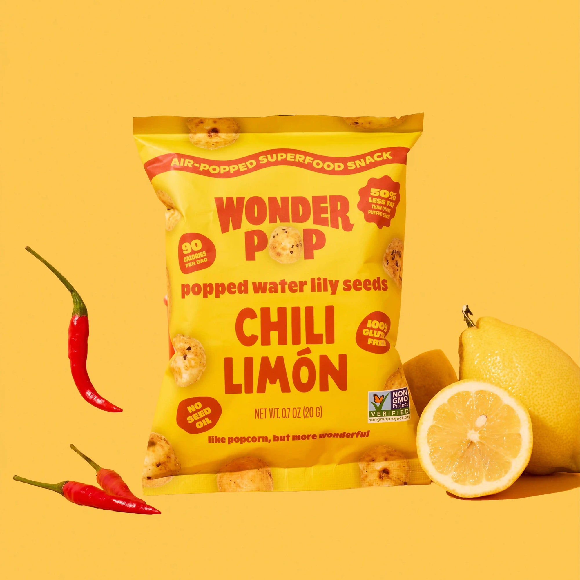 Yellow package of Wonder Pop Chili Limón snack with chili peppers and lemon on a yellow background