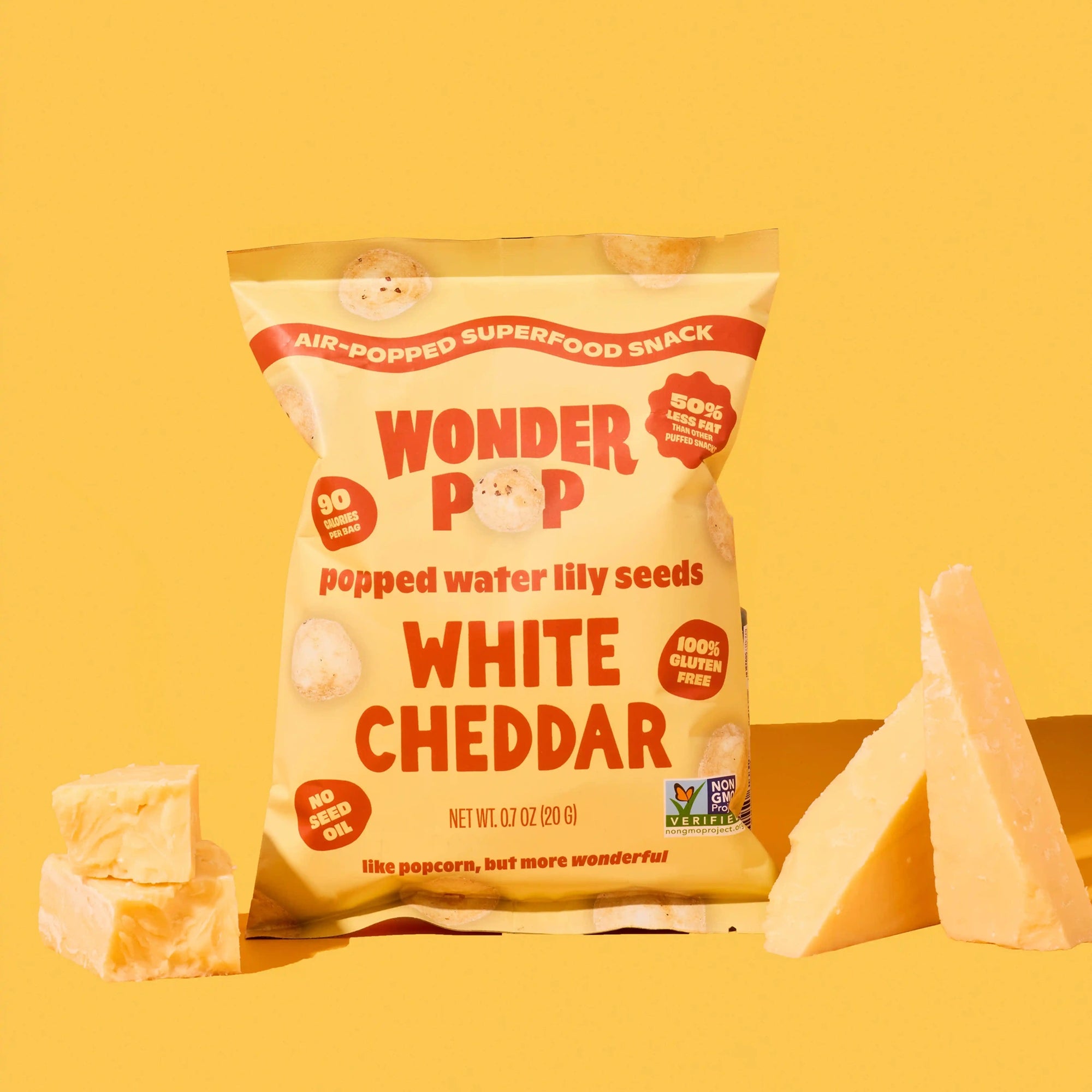 Bag of Wonder Pop white cheddar snack on a yellow background